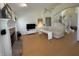 Spacious living room with fireplace, hardwood floors, stairway, and modern decor at 10404 Trillium Ct, Noblesville, IN 46060