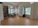 Inviting living room featuring a bookcase, sitting area, and bright windows at 10404 Trillium Ct, Noblesville, IN 46060