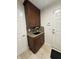 Mud room sink featuring wooden cabinets and white doors at 10404 Trillium Ct, Noblesville, IN 46060