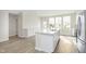 Kitchen features large island, modern appliances, and abundant storage space in white cabinetry at 10953 Belgian Ln, Zionsville, IN 46077