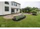 Landscaped backyard featuring a brick patio and pergola, perfect for outdoor entertaining at 11648 Stickney Ct, Fishers, IN 46037
