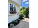 Paver patio featuring flower box under window and pergola with lush landscaping at 11648 Stickney Ct, Fishers, IN 46037