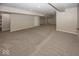 Finished basement with neutral carpeting and columns at 11648 Stickney Ct, Fishers, IN 46037