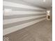 Finished basement featuring gray and white striped wall design at 11648 Stickney Ct, Fishers, IN 46037