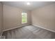 Bedroom with neutral walls and carpeting and a window at 11648 Stickney Ct, Fishers, IN 46037