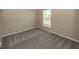 Bedroom with neutral walls and carpeting, and one window at 11648 Stickney Ct, Fishers, IN 46037