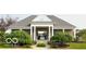 Community clubhouse with a welcoming entrance, landscaping, and architectural details at 11648 Stickney Ct, Fishers, IN 46037