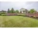 The Estates at Meadow Brook brick community sign with manicured landscaping at 11648 Stickney Ct, Fishers, IN 46037