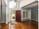 Inviting foyer with hardwood floors, a high ceiling, and a view to the outside at 11648 Stickney Ct, Fishers, IN 46037