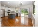 Updated kitchen with stainless steel appliances, granite counters, tile backsplash, and hardwood floors at 11648 Stickney Ct, Fishers, IN 46037