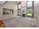 Spacious living room with fireplace, large windows, and pass-through to the kitchen at 11648 Stickney Ct, Fishers, IN 46037