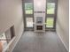A high angle view of a living room with large windows and a fireplace as a focal point at 11648 Stickney Ct, Fishers, IN 46037