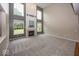 Open living room with a fireplace, high ceilings, and lots of natural light at 11648 Stickney Ct, Fishers, IN 46037