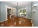 Open concept living room with hardwood floors, natural light, and architectural details at 11648 Stickney Ct, Fishers, IN 46037