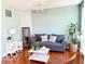 Cozy living room with hardwood floors, comfortable seating, and natural light at 11648 Stickney Ct, Fishers, IN 46037