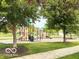 Community playground featuring slides and climbing structures, surrounded by lush greenery at 11648 Stickney Ct, Fishers, IN 46037
