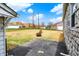 Backyard featuring a large grassy area with a stone facade on the home at 1194 S Faculty Dr, Indianapolis, IN 46241