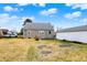Backyard featuring a stone-clad home and detached garage, offering ample space at 1194 S Faculty Dr, Indianapolis, IN 46241