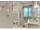 Bathroom with floral wallpaper, tiled walls, and features a walk-in shower at 1194 S Faculty Dr, Indianapolis, IN 46241