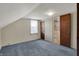 Bedroom with gray carpet, white walls, window with blinds and doorway to bathroom at 1194 S Faculty Dr, Indianapolis, IN 46241