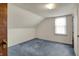 Angled room with blue carpet, white walls, and a window at 1194 S Faculty Dr, Indianapolis, IN 46241
