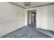 Dining room with blue carpet and view of a hallway at 1194 S Faculty Dr, Indianapolis, IN 46241