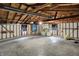 Unfinished garage with high ceiling, work area and open walls at 1194 S Faculty Dr, Indianapolis, IN 46241