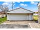 Detached one car garage exterior featuring white siding and concrete driveway at 1194 S Faculty Dr, Indianapolis, IN 46241