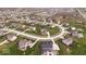 Aerial view of the property showcasing lush green lawns and mature trees in a desirable neighborhood at 1243 Colinbrook Cir, Greenwood, IN 46143