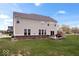 Spacious backyard featuring a two-story home and a wooden deck perfect for outdoor entertaining at 1243 Colinbrook Cir, Greenwood, IN 46143