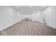 Large finished basement area featuring stairs, a door, and a ping pong table at 1243 Colinbrook Cir, Greenwood, IN 46143