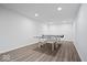 Finished basement with a ping pong table and recessed lighting at 1243 Colinbrook Cir, Greenwood, IN 46143