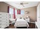 Light-filled bedroom featuring matching furniture, soft bedding, and large windows at 1243 Colinbrook Cir, Greenwood, IN 46143