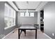 Dining room showcases tray ceilings, large windows, and modern pendant lighting at 1243 Colinbrook Cir, Greenwood, IN 46143