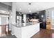Well-equipped kitchen with dark cabinetry, stainless steel appliances, and a granite-topped island at 1243 Colinbrook Cir, Greenwood, IN 46143