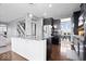 Stylish kitchen with dark cabinets, granite countertops, and stainless steel appliances offers a modern cooking space at 1243 Colinbrook Cir, Greenwood, IN 46143