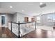 Spacious loft area featuring hardwood floors, neutral walls, and abundant natural light at 1243 Colinbrook Cir, Greenwood, IN 46143