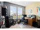 Bright office space with large window, modern desk setup, and musical instruments at 1243 Colinbrook Cir, Greenwood, IN 46143
