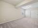 Finished basement with neutral carpet, and a sliding door closet, perfect for storage at 12907 Shiraz Ln, Fishers, IN 46037