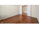 Cozy bedroom features rich hardwood floors and bright white trim throughout the space at 12907 Shiraz Ln, Fishers, IN 46037