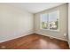 Sunlit bedroom with wood floors, a double window, and neutral walls perfect for relaxation at 12907 Shiraz Ln, Fishers, IN 46037