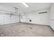 Spacious two-car garage with concrete flooring and an automatic door opener offers ample storage space at 12907 Shiraz Ln, Fishers, IN 46037