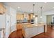 Modern kitchen with granite countertops, stainless steel appliances, and hardwood floors at 12907 Shiraz Ln, Fishers, IN 46037