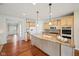 Spacious kitchen with granite countertops, hardwood floors, and stainless steel appliances at 12907 Shiraz Ln, Fishers, IN 46037