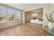 This expansive living room boasts neutral colors, large windows, and seamlessly connects to the Gathering room at 12907 Shiraz Ln, Fishers, IN 46037