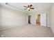 A spacious main bedroom includes a ceiling fan and an ensuite bathroom for optimal convenience at 12907 Shiraz Ln, Fishers, IN 46037