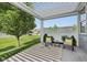 Cozy outdoor patio space shaded by a pergola, featuring comfortable seating and sunny accents at 12907 Shiraz Ln, Fishers, IN 46037