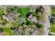 Aerial view of a home with a well-manicured lawn, surrounded by lush greenery at 13892 Adios Pass, Carmel, IN 46032