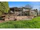 Beautiful backyard with a wooden deck, gazebo, and stone patio, perfect for outdoor entertaining at 13892 Adios Pass, Carmel, IN 46032