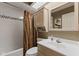 Standard bathroom with vanity with white sink and shower with curtain at 13892 Adios Pass, Carmel, IN 46032